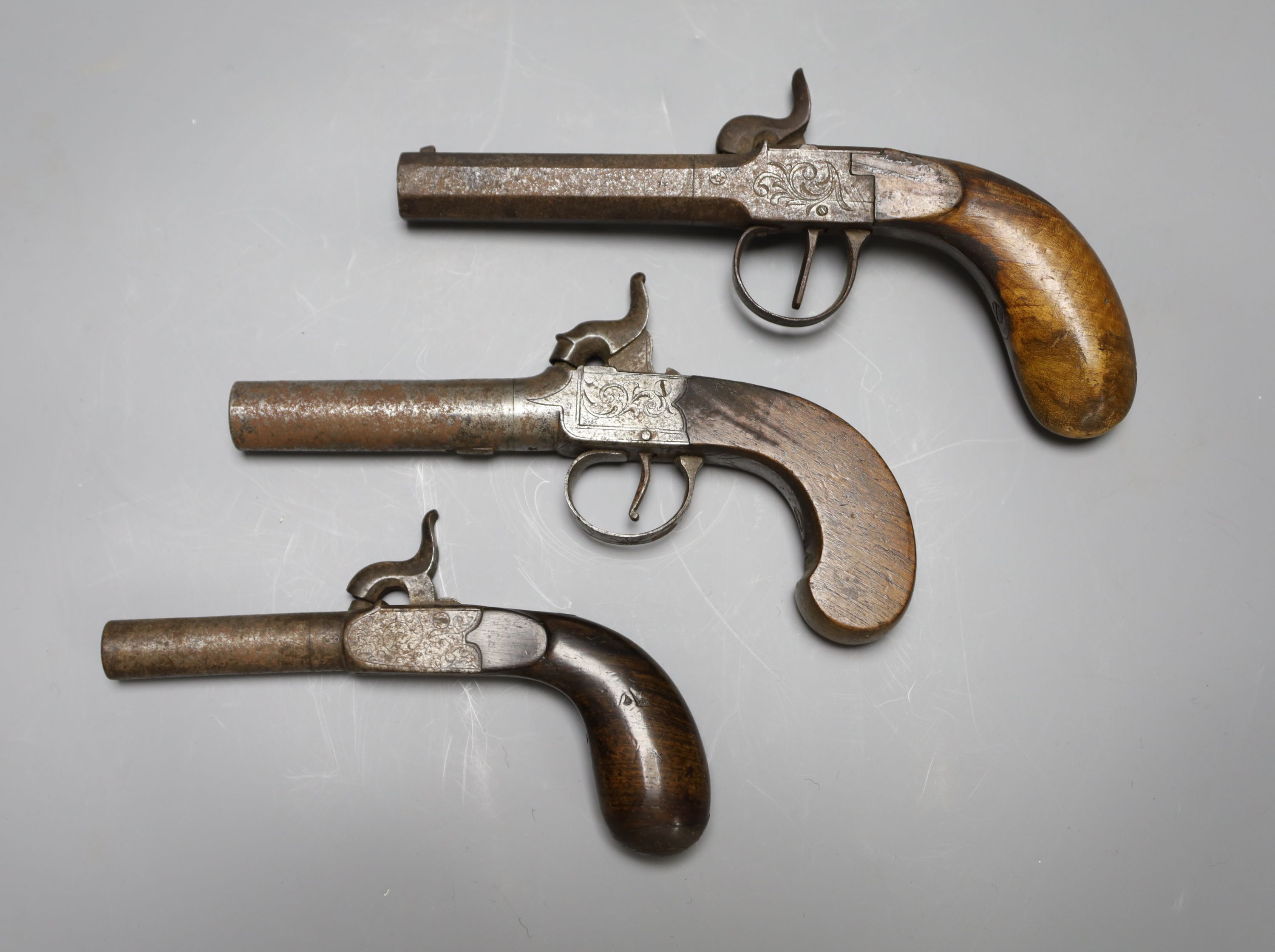 A Wilson of London box lock percussion cap pistol and two others